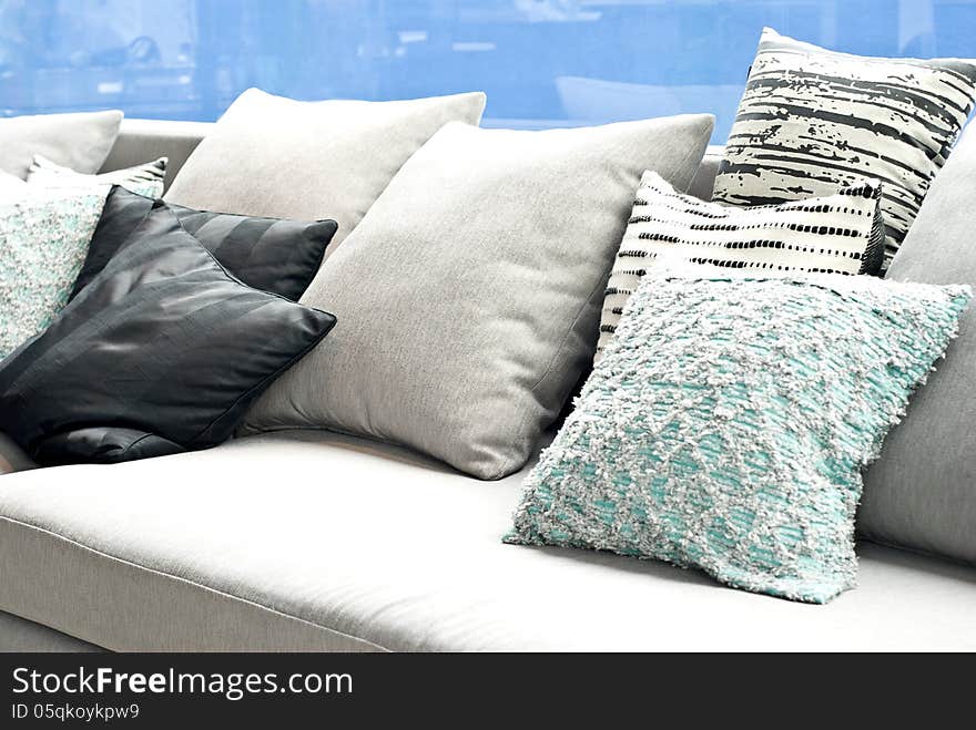 Various size and clor of cushion pillows on sofa