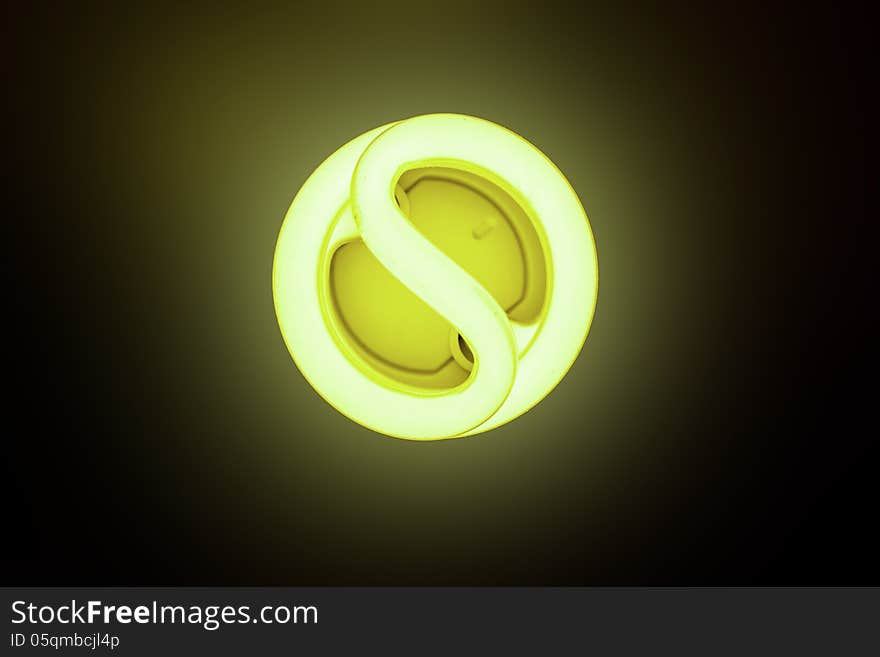 Included energy-saving lamp on a dark background. Included energy-saving lamp on a dark background