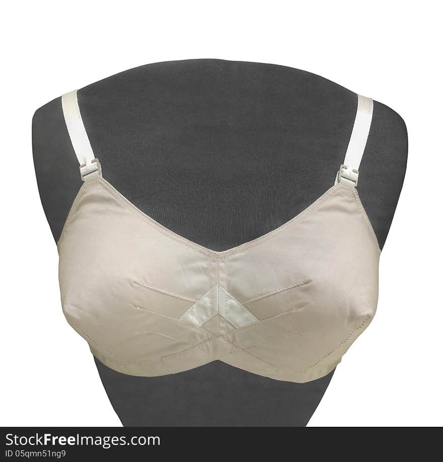 Antique woman’ white silk bra on a black chest mannequin. Isolated on white. Antique woman’ white silk bra on a black chest mannequin. Isolated on white.