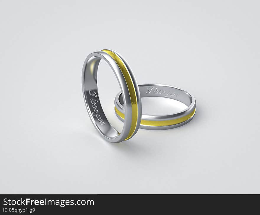 Pair of inscripted silver golden wedding rings