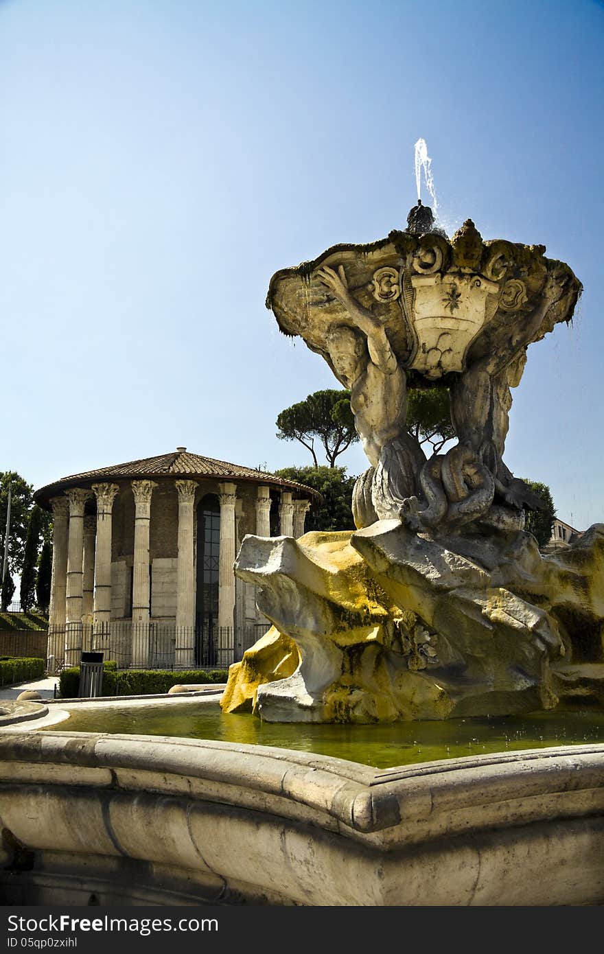 View of fountain of Tritons and Temple of Ercole in front of the Bocca della Verità in Rome, Italy. View of fountain of Tritons and Temple of Ercole in front of the Bocca della Verità in Rome, Italy.