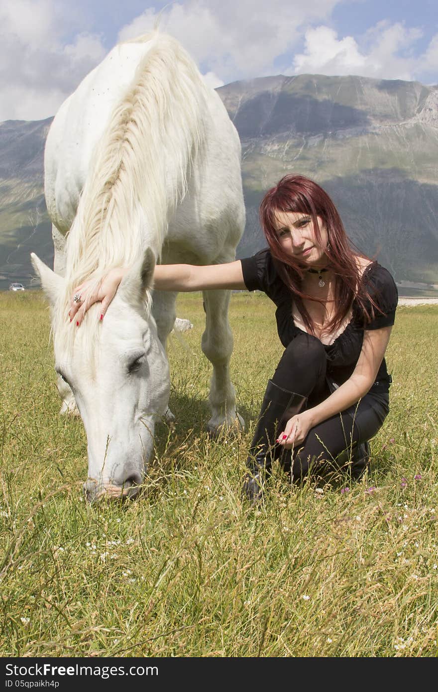 Woman with white horse