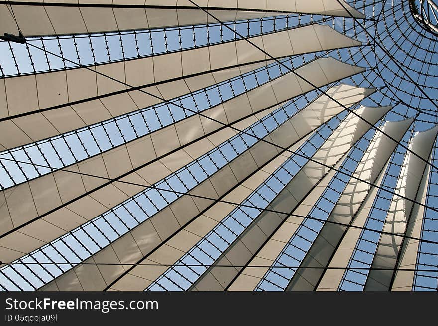 Part of modern architecture roof with semitransparent wings and wire