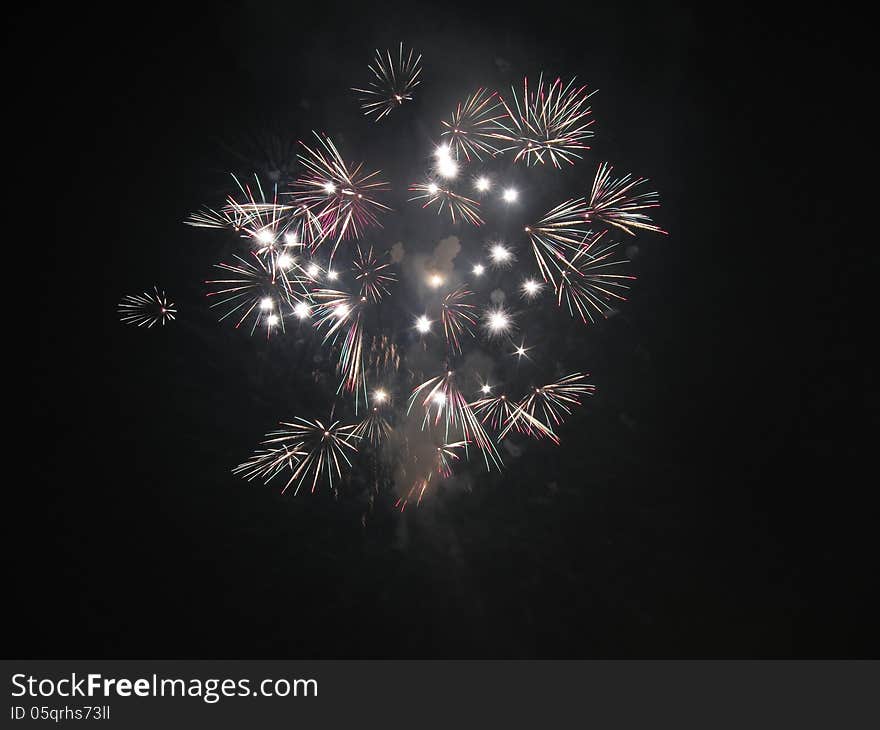 Many white firework on bangkok night sky