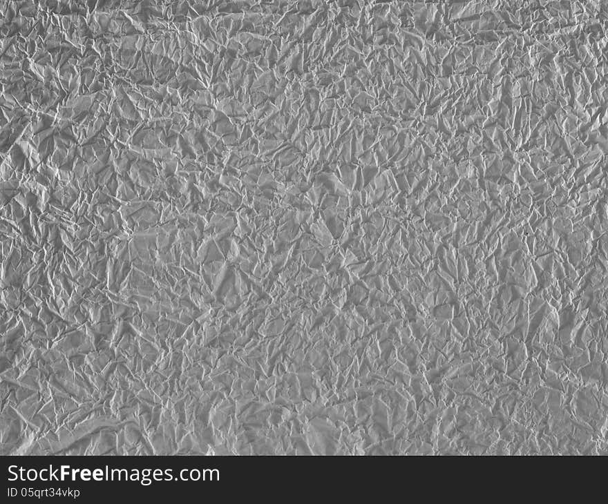 Background from sheet of a crushed grey paper. Background from sheet of a crushed grey paper