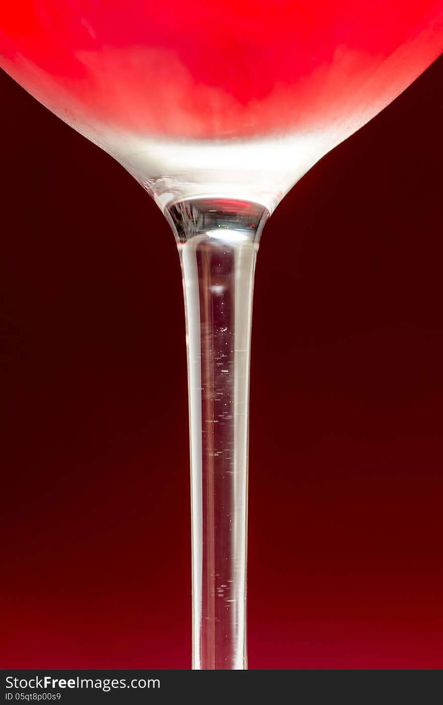 Wineglass with cold red wine