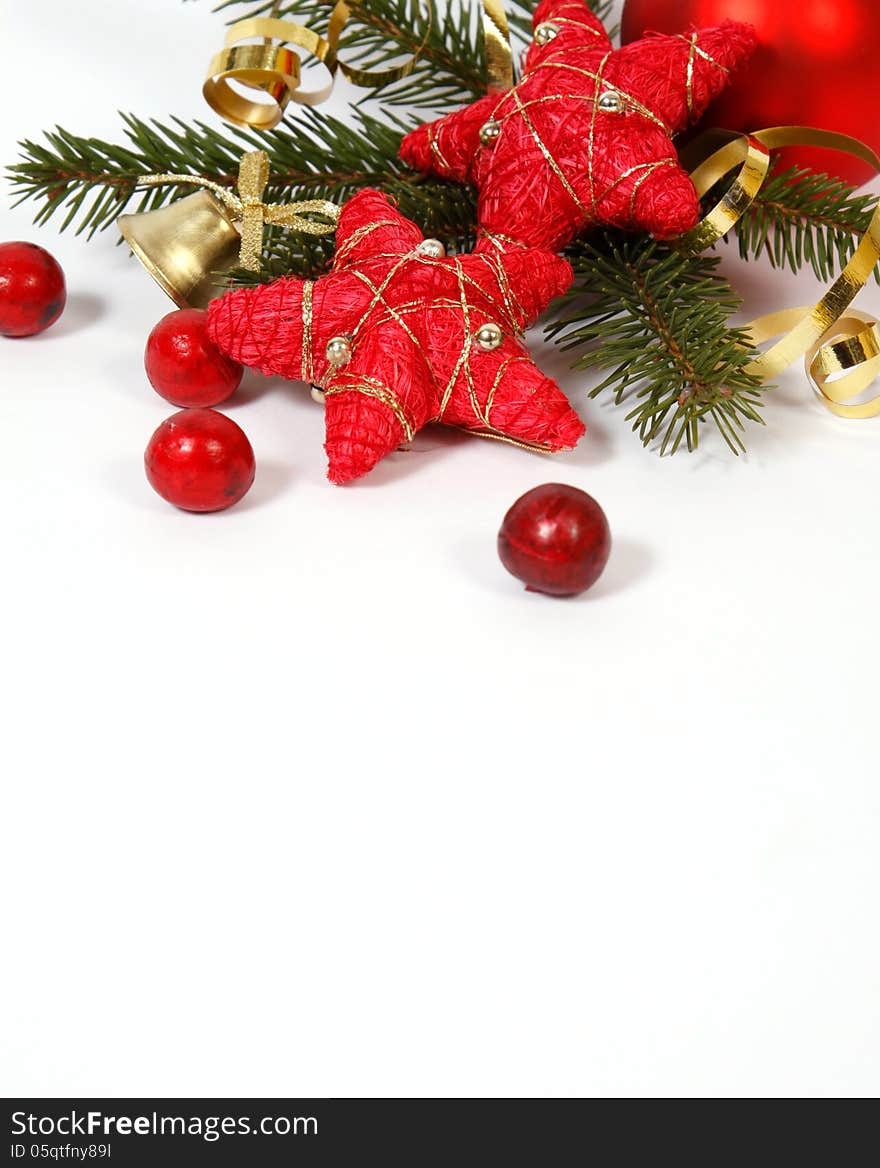 Christmas decoration with the twigs of the spruce and red stars