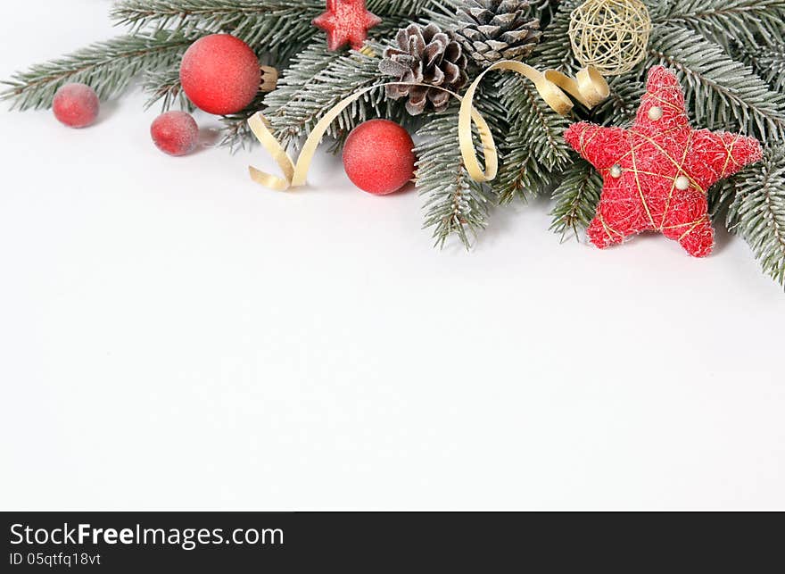 Christmas decoration with the twigs of the spruce and baubles