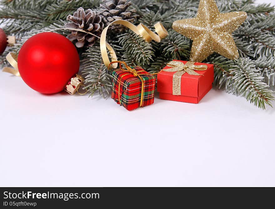 Christmas decoration with the twigs of the spruce and baubles