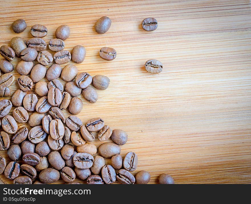 Coffee beans on wooden table