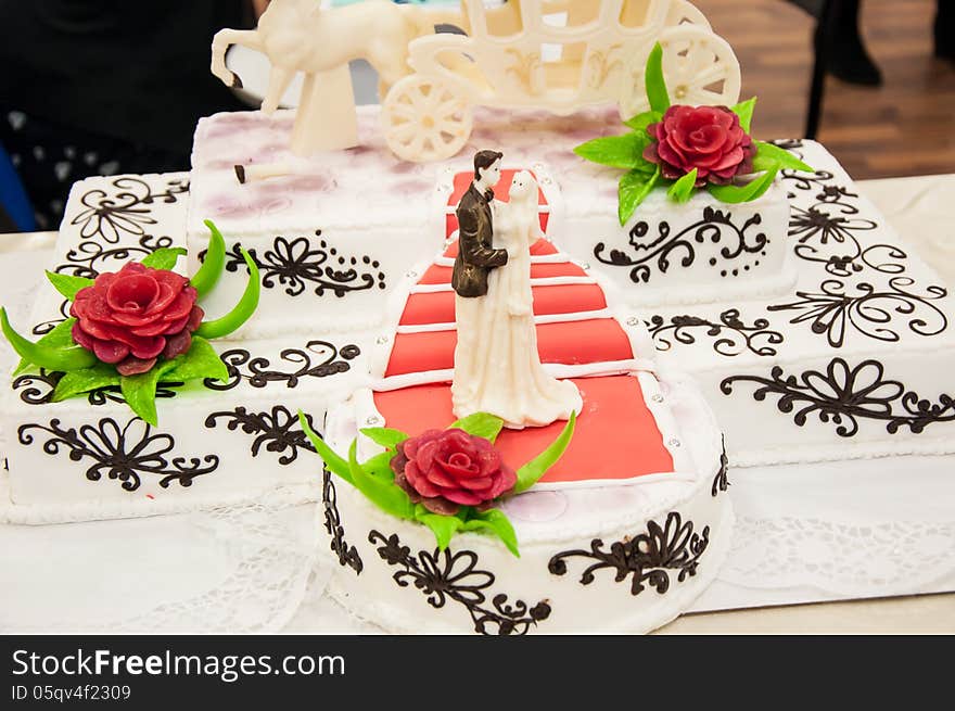 Decorating a wedding cake.