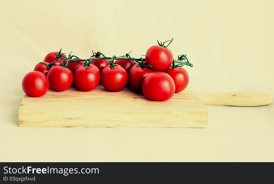 Cherry tomatoes isolated in vintage background