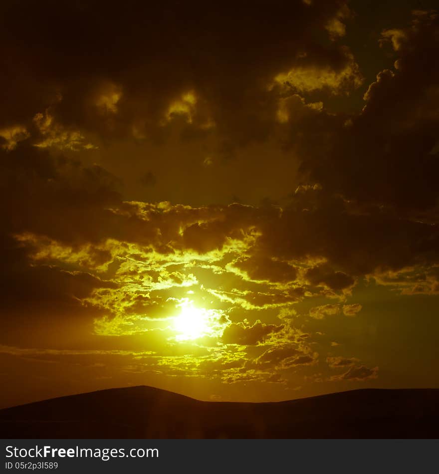 Beautiful sunset in countryside with cloudy sky