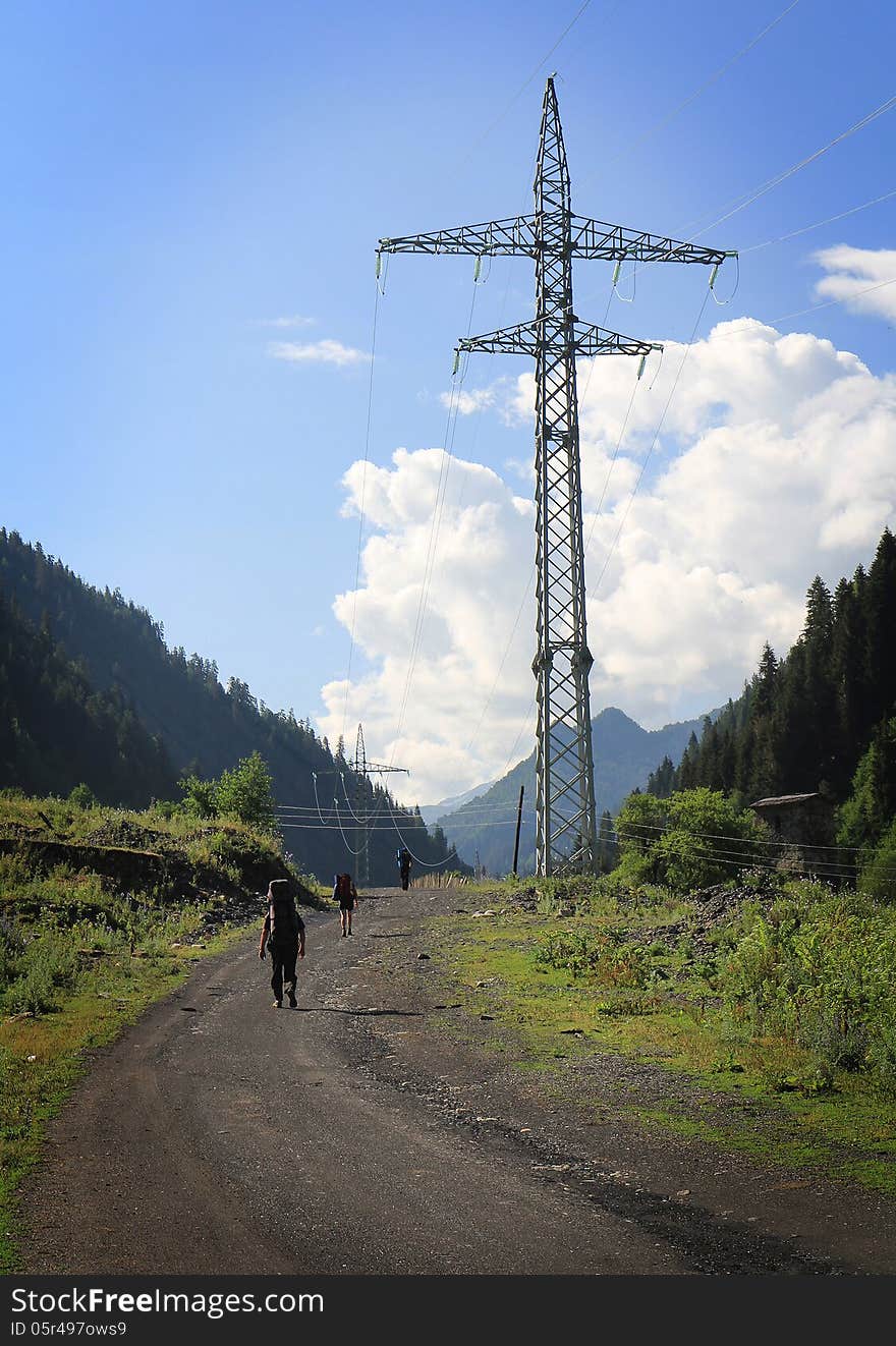 Group of tourists hiking in mountains