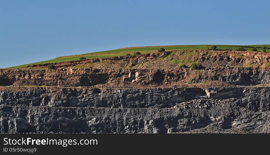 Landscape with rock quarry in a hill