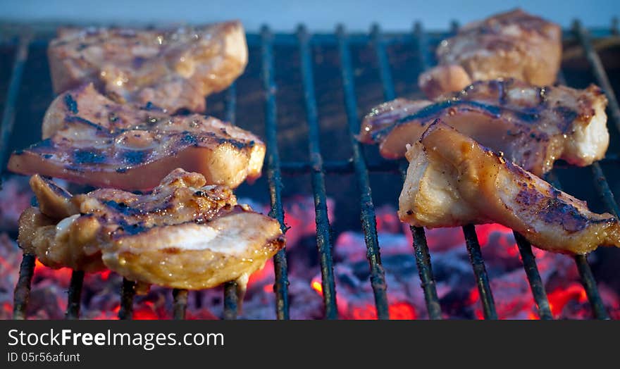 Barbecue grill pork on fire