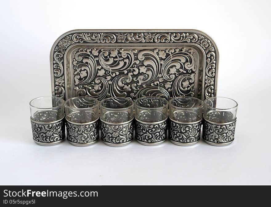 Old silver wine glasses with a tray