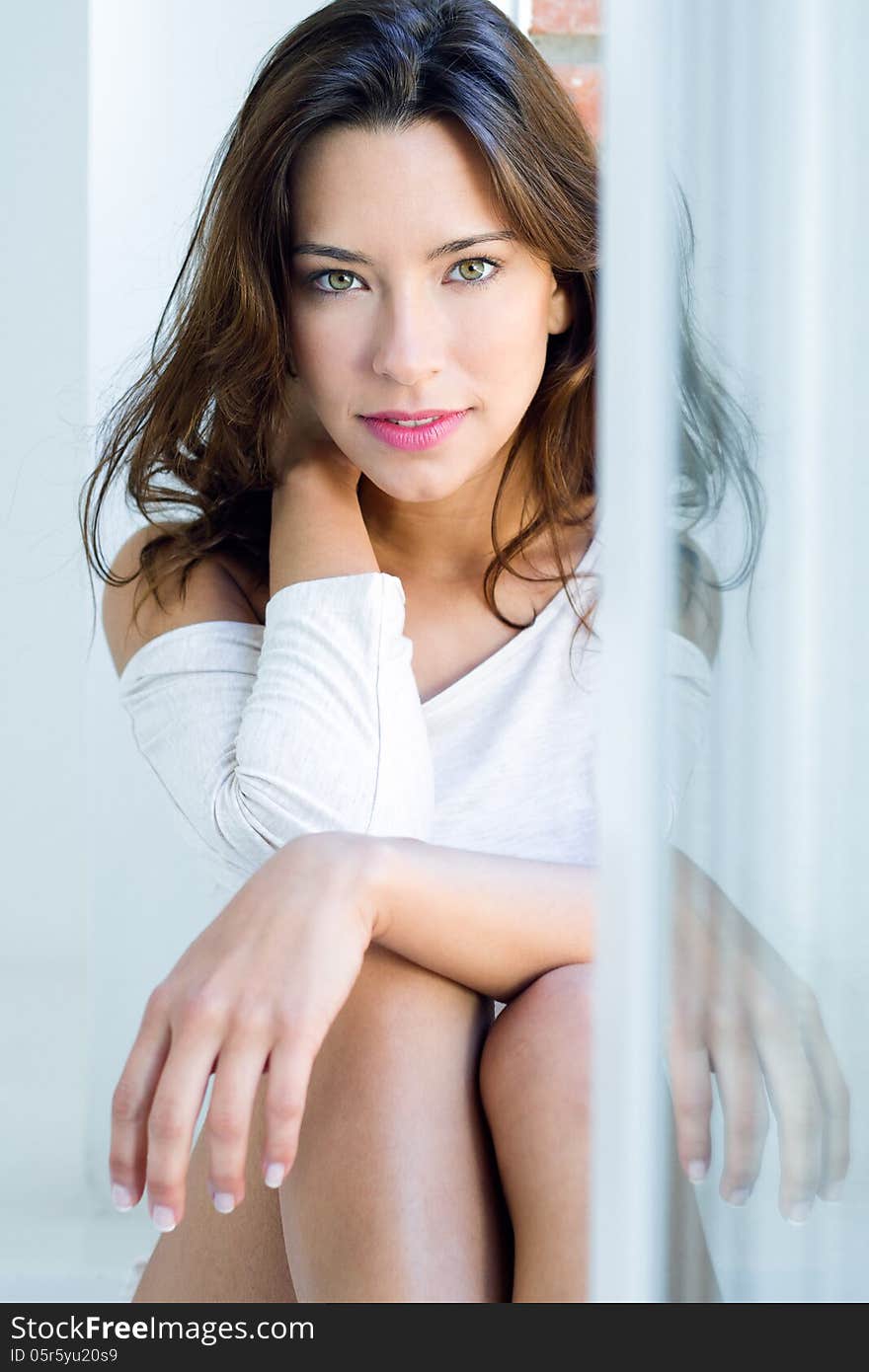 Portrait of beautiful woman with smile at home