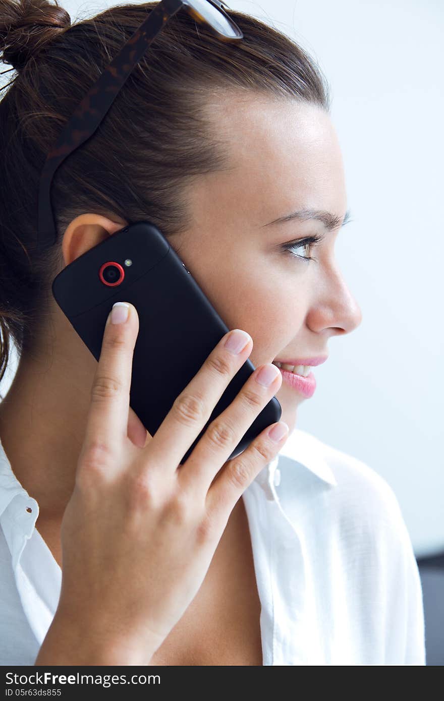 Young woman talking on the mobile phone