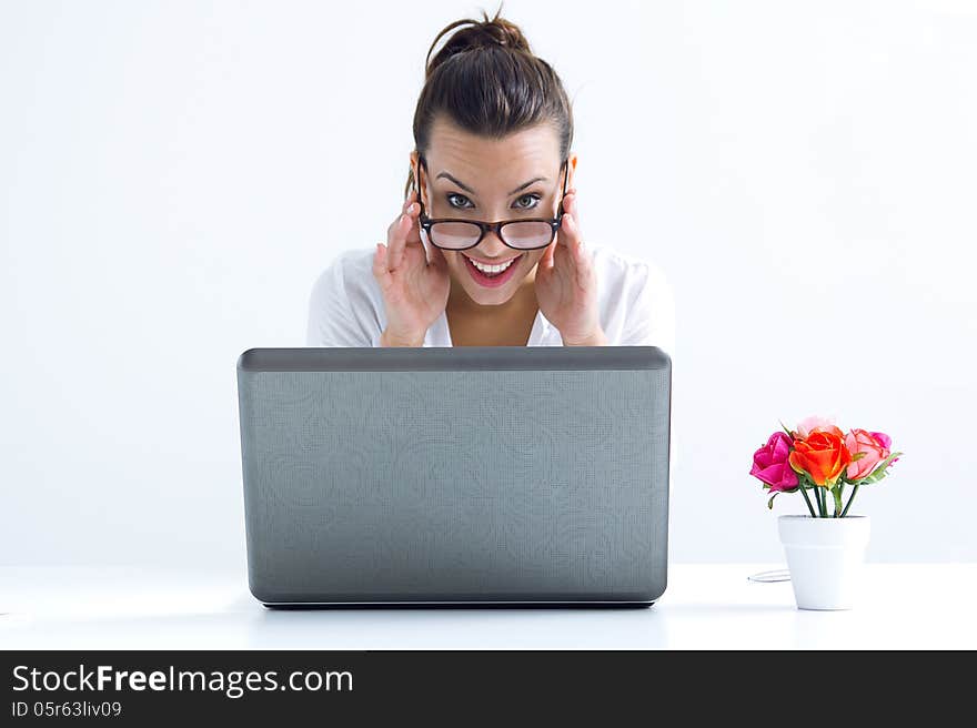 Woman with laptop working at home