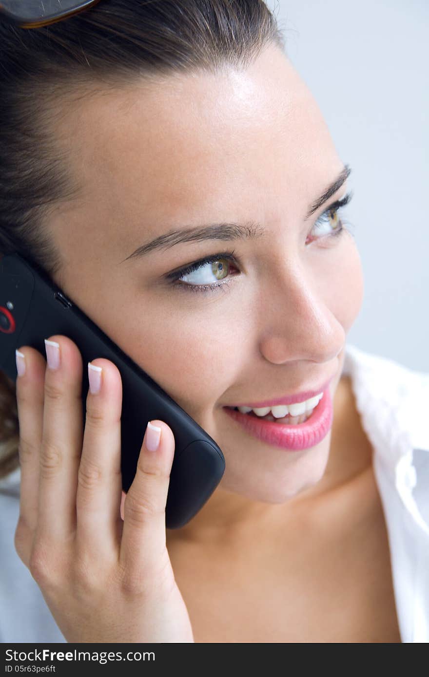 Young woman talking on the mobile phone