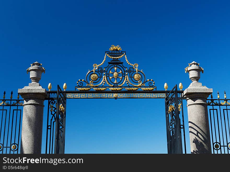 The gate and fence on a blue sky background. Summer Garden, St. Petersburg, Russia