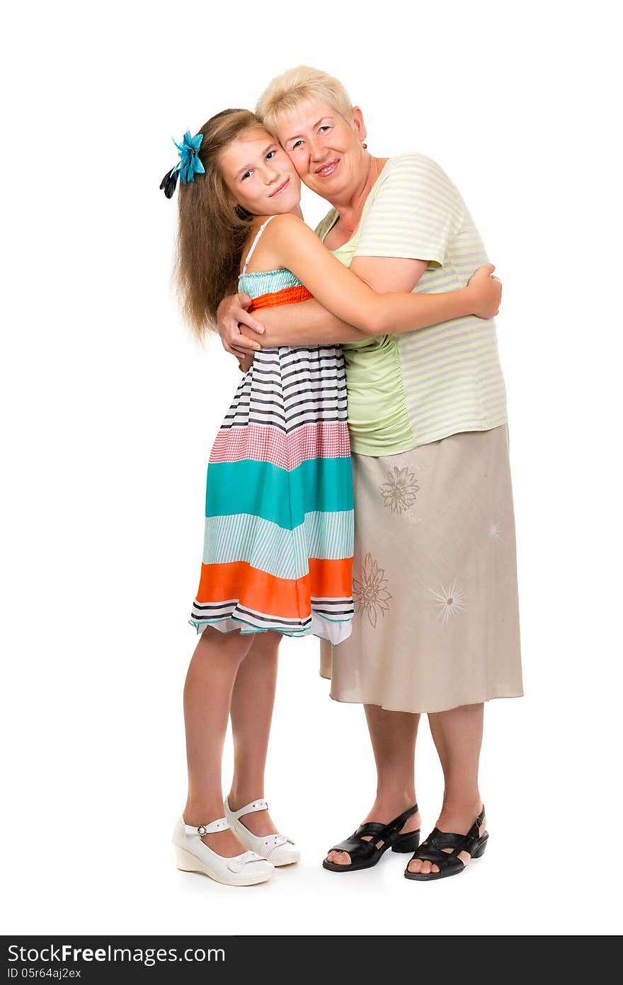 Grandmother with her granddaughter in the studio on a white isolate.