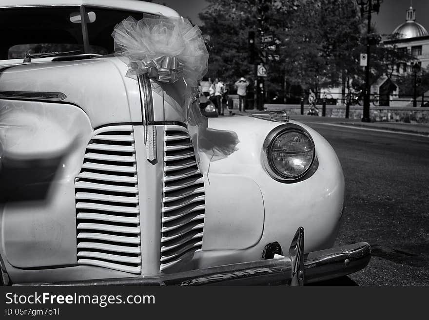 Vintage old Chevrolet awaits the return of the newly weds from the photo soot in Old Montreal. Vintage old Chevrolet awaits the return of the newly weds from the photo soot in Old Montreal