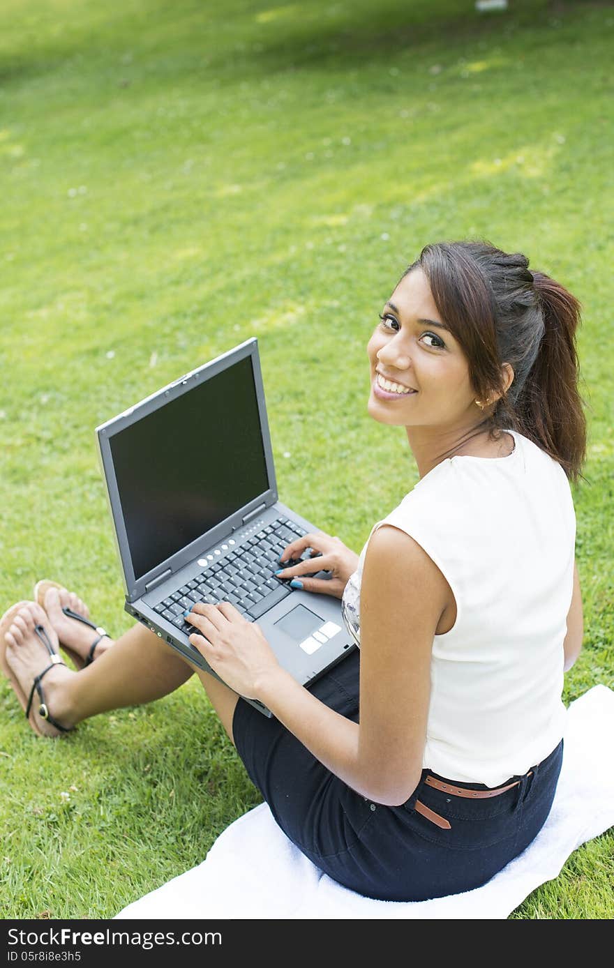 Smile Businesswoman with Computer in the Park.