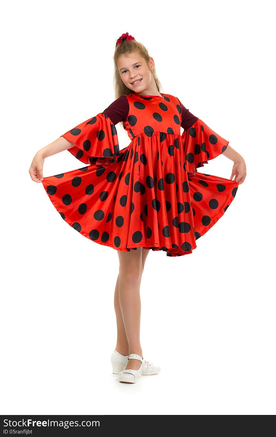 Teen girl in a red dress with polka dots. Isolate on white.