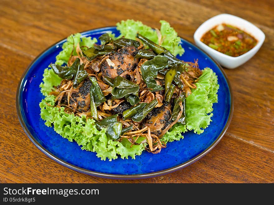 Fried fish with spicy sauce