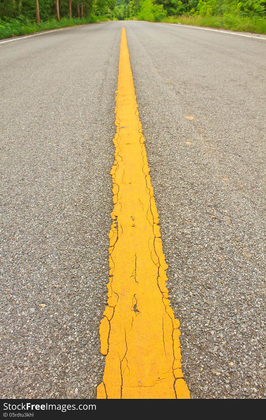 Asphalt dark texture with yellow lines