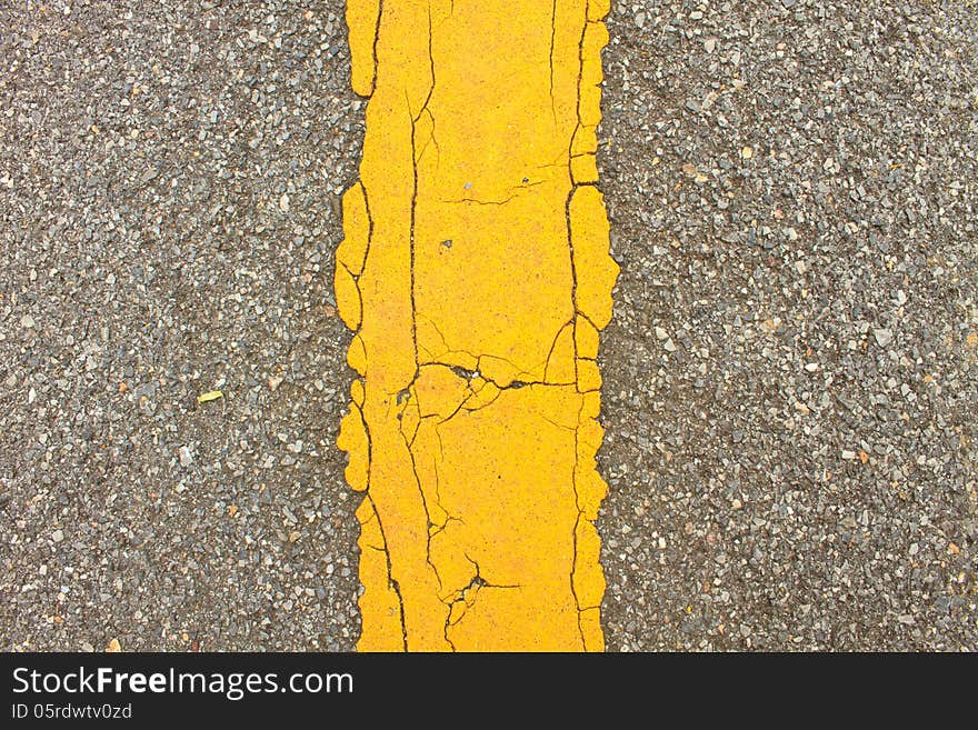 Asphalt dark texture with yellow lines