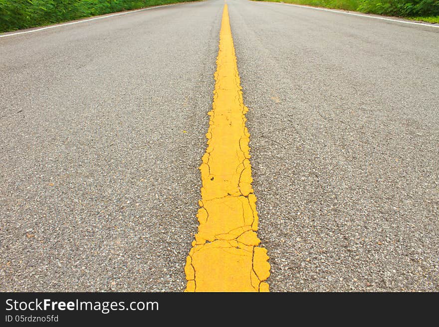 Asphalt dark texture with yellow lines