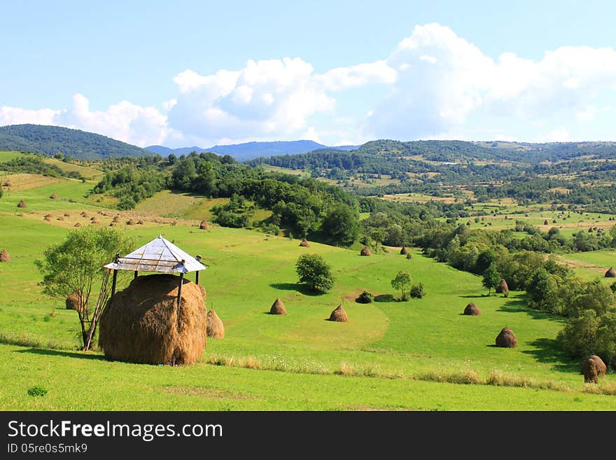 Haystack with the roof over on the field