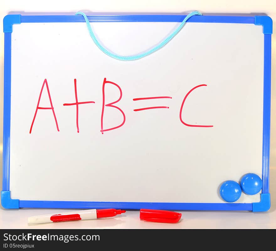 The first three letters of the alphabet A B and C written on a white board in red ink. Symbolic of learning or education. The first three letters of the alphabet A B and C written on a white board in red ink. Symbolic of learning or education.