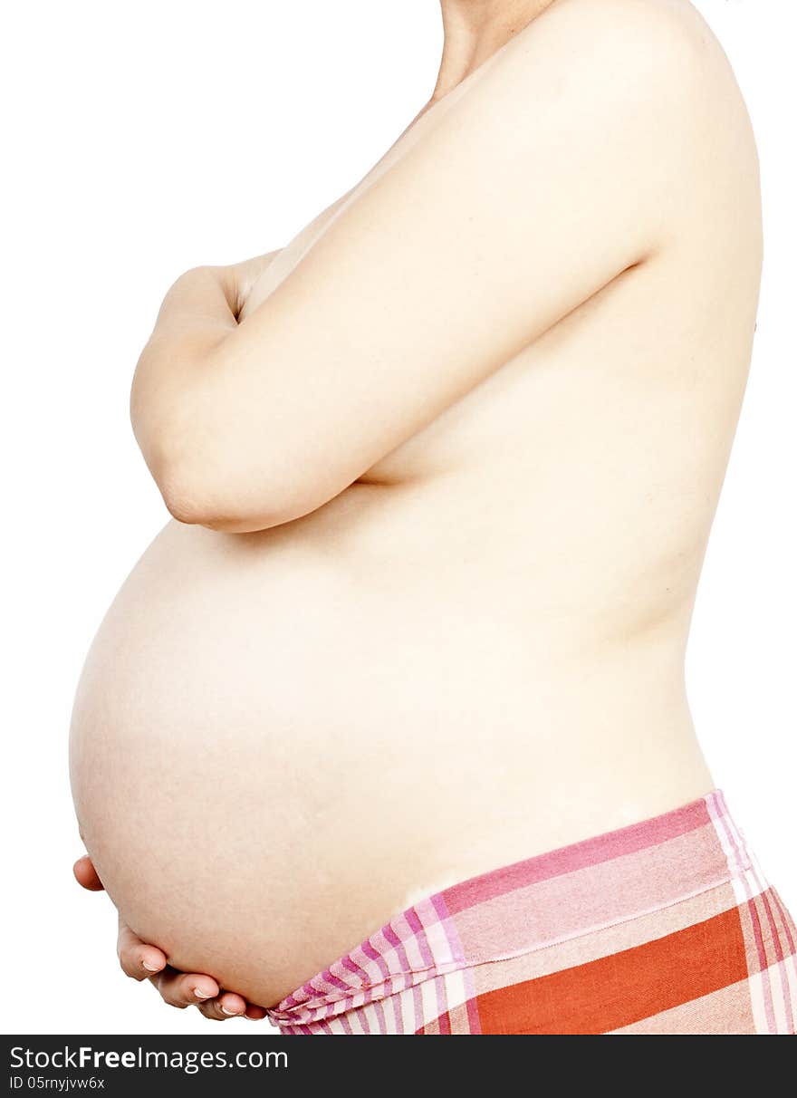 Belly of pregnant woman on white background