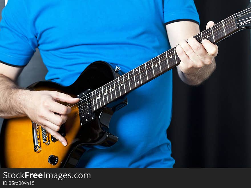 Close up on man playing electric guitar. Close up on man playing electric guitar