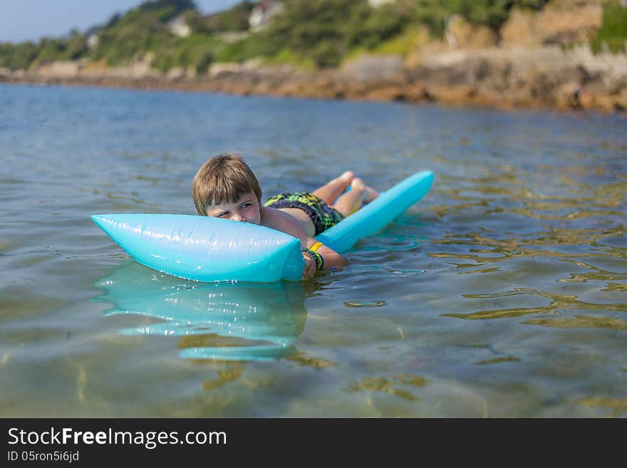 Boy  on inflatable mattrass