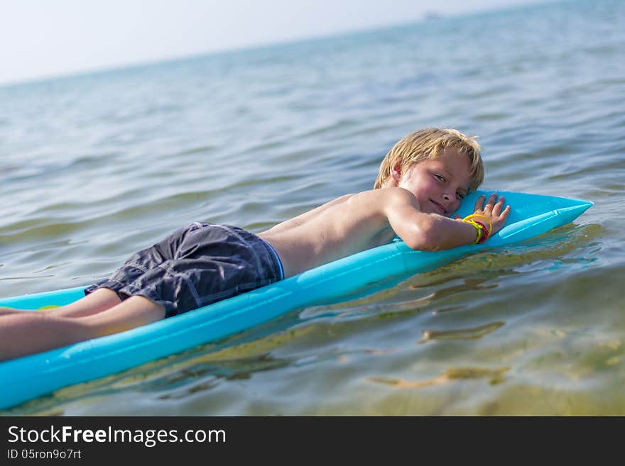 Boy  on inflatable mattrass