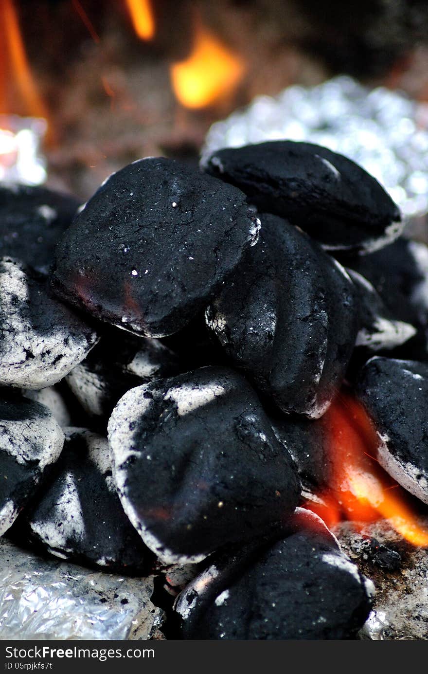 Black charcoal burning macro image