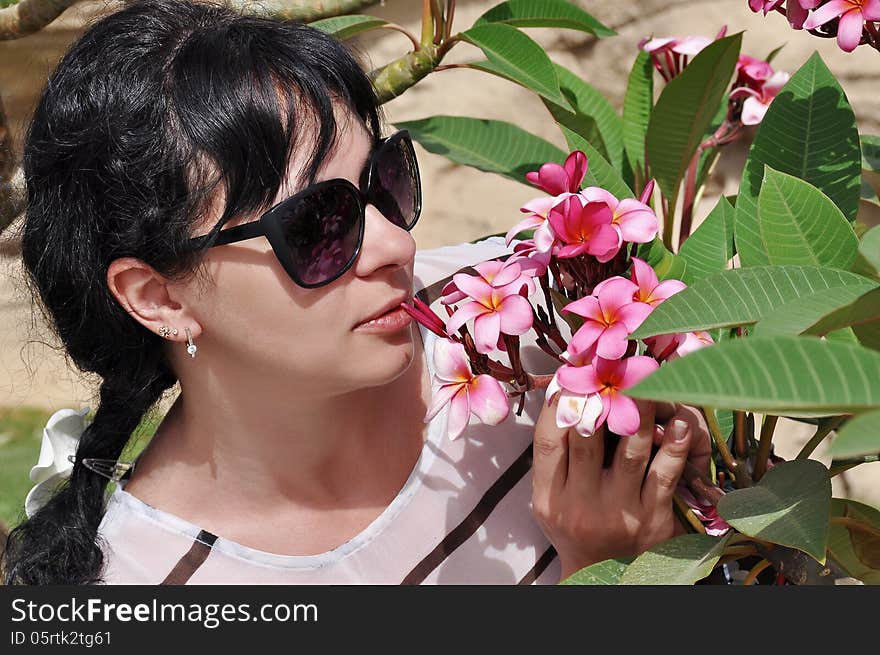 Young girl on a background of flowers