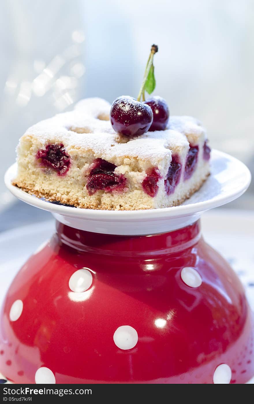 Cherry pie s bars on red polka dot cup