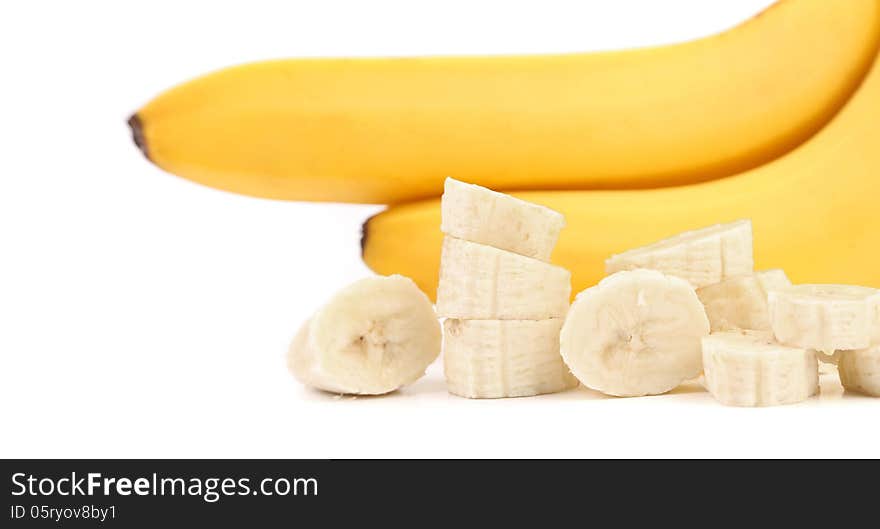 Ripe bananas and piece isolated on white