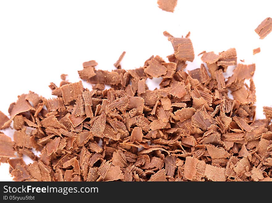 Slices of chocolate. Frame. Top of background is white.