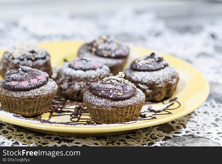 Diet chocolate cupcakes on a plate decorated with chocolate. From the series Recipes for diet Ducane. Diet chocolate cupcakes on a plate decorated with chocolate. From the series Recipes for diet Ducane