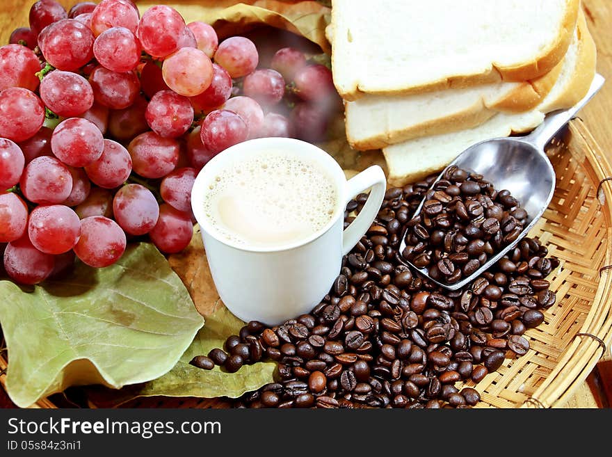 Hot coffee with grapes