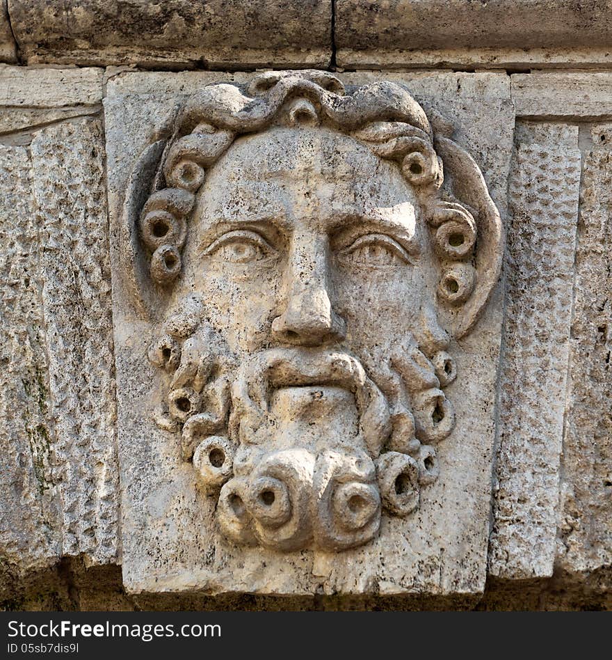 Sculpture in stone face with a beard close-up. Sculpture in stone face with a beard close-up