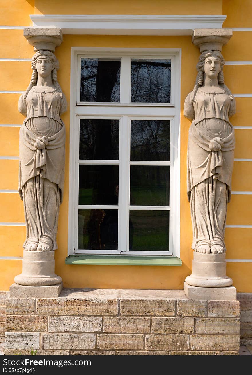 Window with sculptures in the form of ancient women