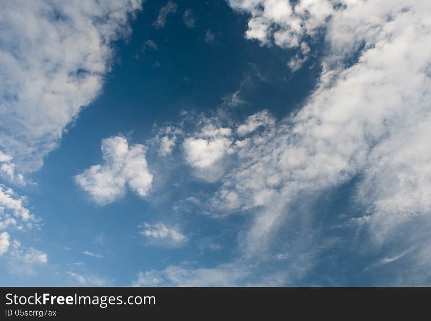 White fluffy clouds in the blue sky. White fluffy clouds in the blue sky